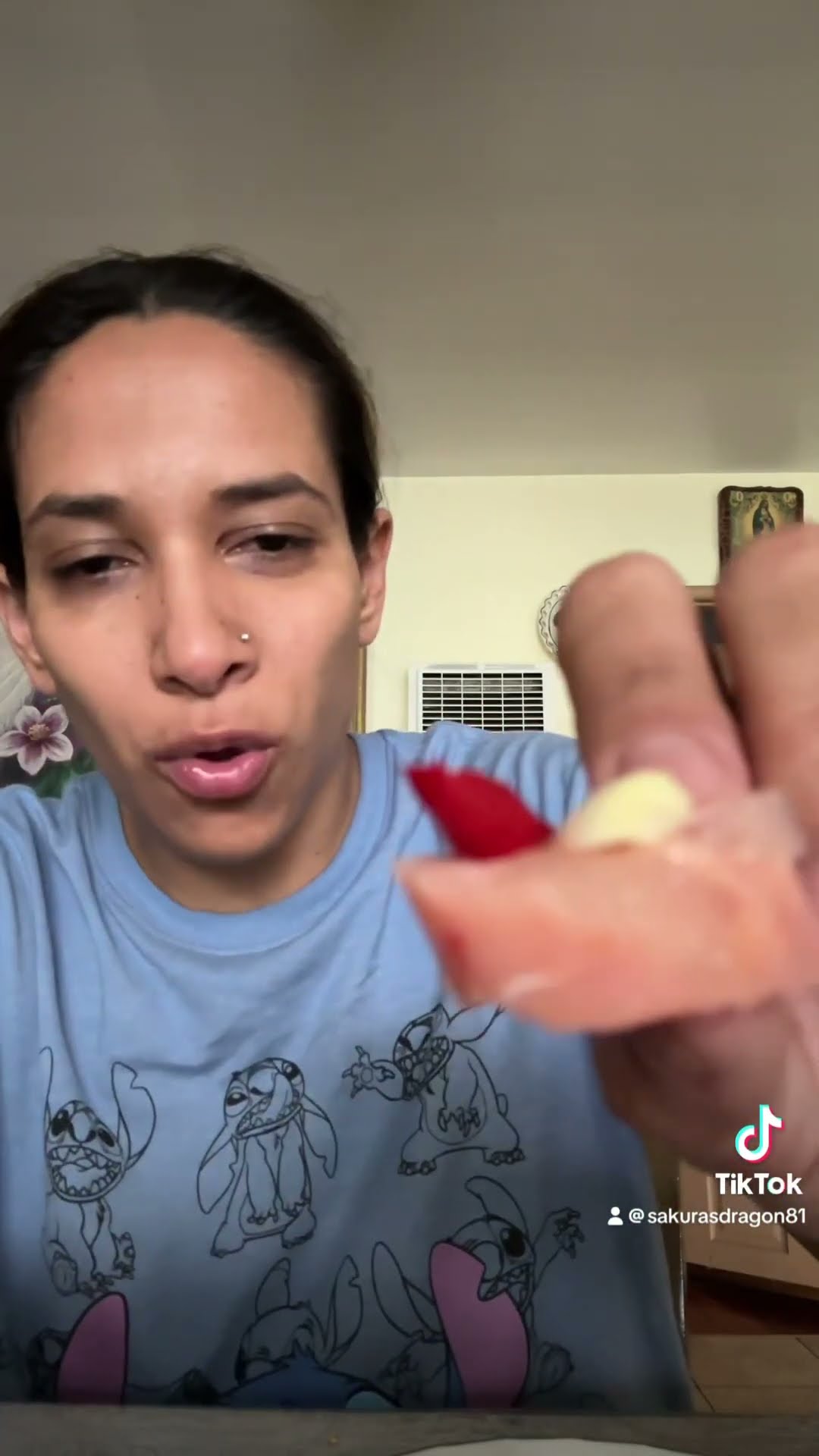 Eating nem chau fermented beef meat Asian style extra spicy Thai chili ...