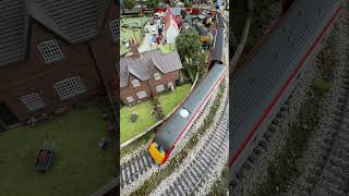 Transport for Wales passes the village. 67014 and DVT 82229