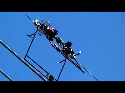 Drone-deployed Mini LineFly robot places Bird-Flight Diverters on power lines