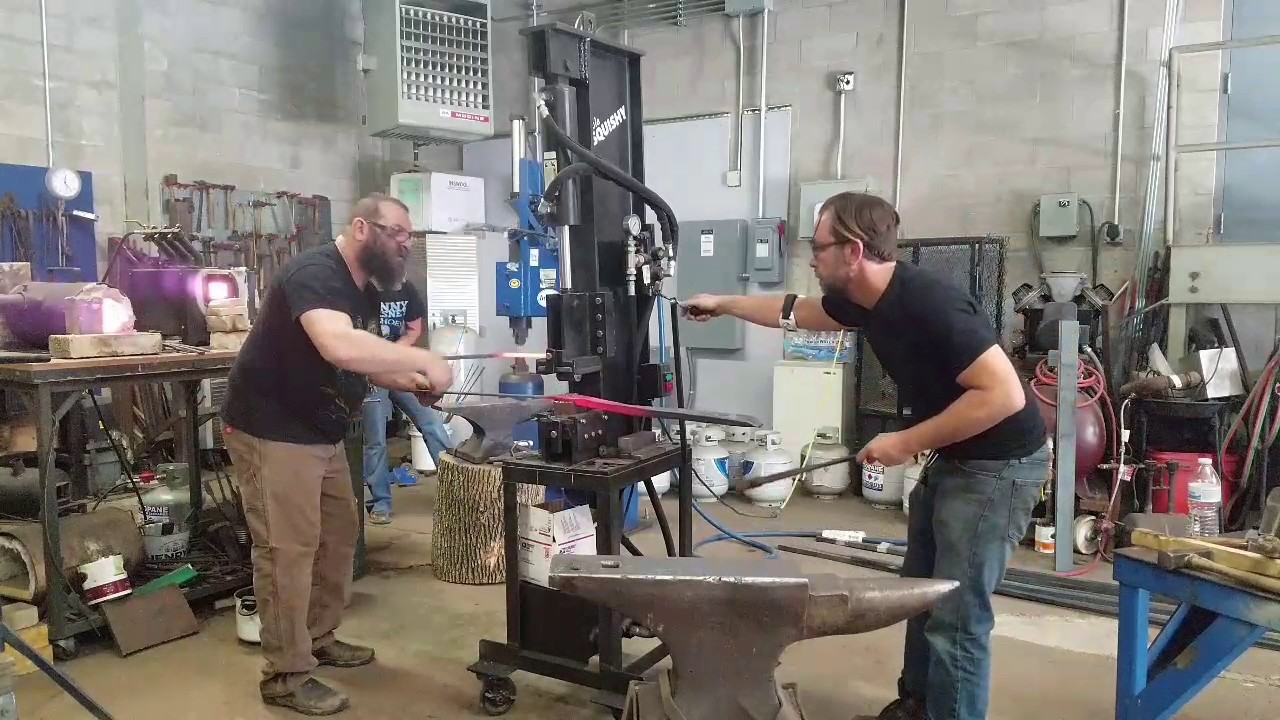 Forging a rail cap for a staircase.
