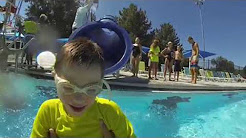 photo of young boy wearing goggles at the pool
