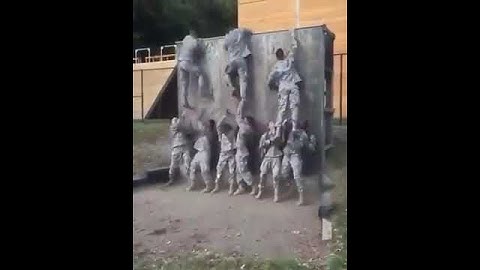 How U.S Army climb on the tall wall.