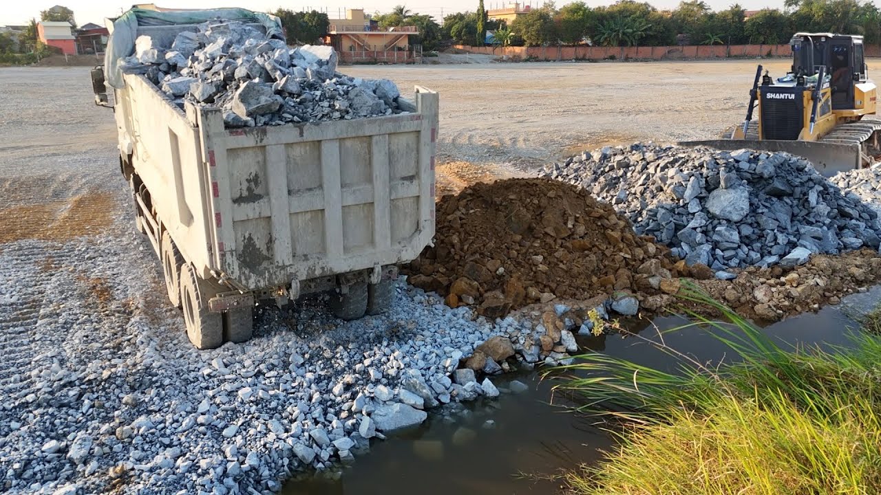 New be careful job !! Massive fill using dump trucks transport stone soil & Push by Powerful Dozer