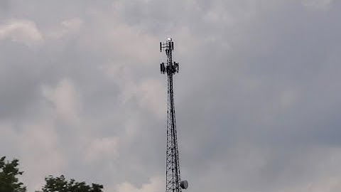 A red and white tower with an fh-308 & 300mm beacon setup