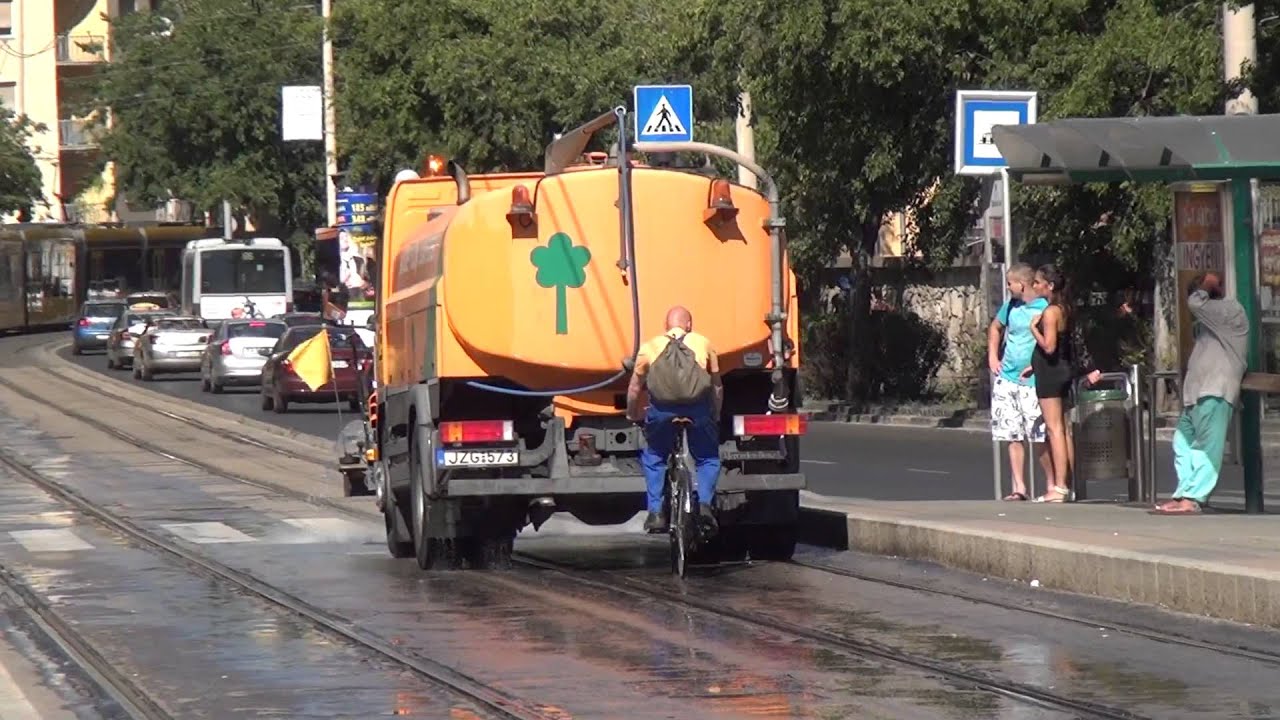 Budapest Tram - track watering vehicle and epic bicycle rider :D