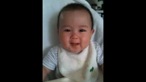 Auntie Gretchen feeding baby Alden