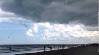 Possible waterspout at cocoa beach sends umbrellas flying