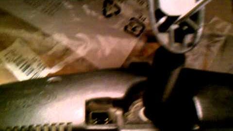 Remove the button from an s10 rear view mirror