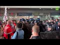 Paris airport workers block terminal & scuffle with police in pay cut protest