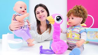 Oyuncak bebek Baby Born. Flamingo ile tuvalet eğitimi yapıyoruz! Kızlar için bebek bakma oyunu