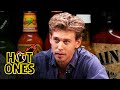 Austin butler searches for comfort while eating spicy wings  hot ones