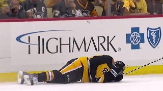 Kessel gets hit in the head with a puck by teammate