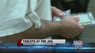 Inmates using tablets at the Pima County Jail