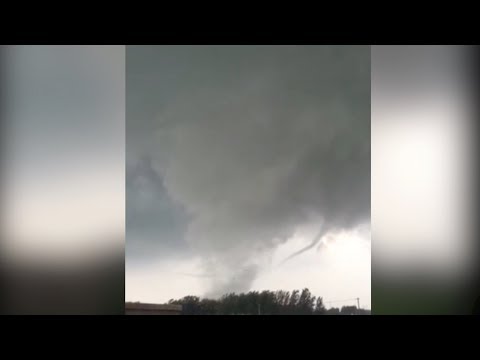 Dramatic footage of a powerful tornado touching down in China