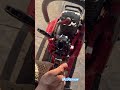 Adjusting the carburetor of a chainsaw.