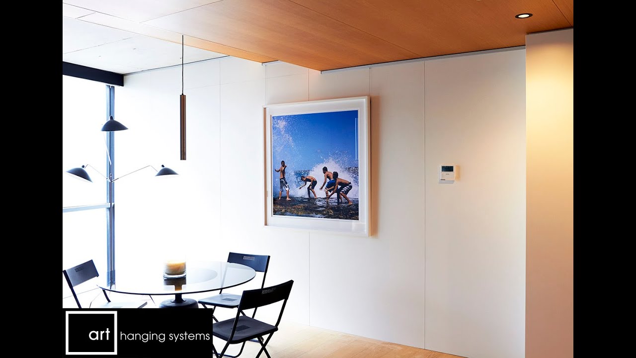 Click Rail to hang large art collection