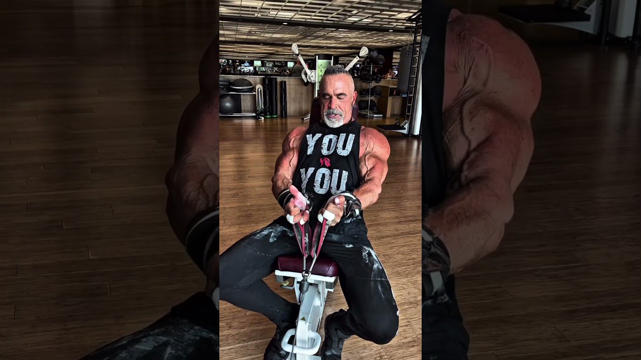 Seated cable curls on an incline bench allow for focused intensity on the biceps.