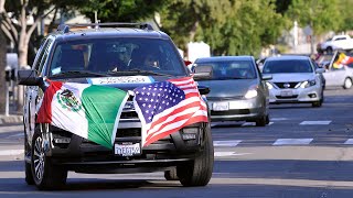 Caravan winds through downtown in support of immigrants