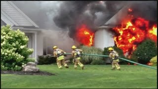 Firefighters battle raging house fire in Southwick
