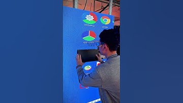 The technician is installing the indoor LED screen with a suction cup. #leddisplay #ledwall #shorts