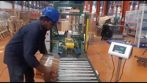 SIGNODE MAKE WEIGHING WITH AUTOMATIC TAPING MACHINE