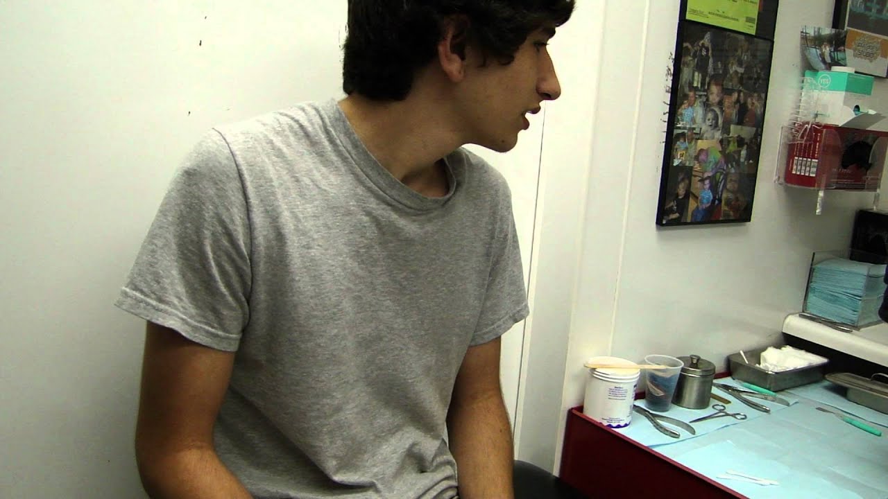 Guy Getting His Ears Pierced