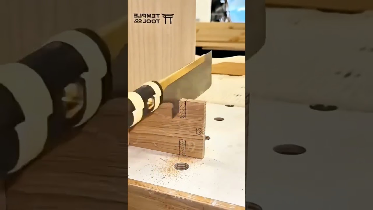 cutting precise wood joints using a pull saw and finishing the details with a sharp metal chisel,