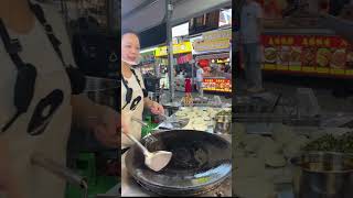 This Ladys Scallion Pancakes Sizzling Fresh On The Griddle five Bucks For A Thick Hearty Pie