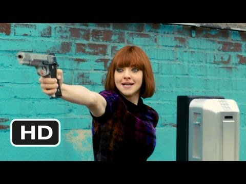 Still: Sylvia pulls a gun at the payphone — In Time