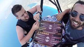 Paraglider Plays Backgammon While In The Sky