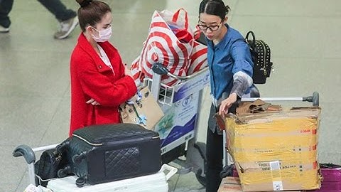 Tin Nhanh - Ngọc Trinh bịt mặt kín mít khi về nước