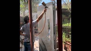 puerta de tambor en herrería con cristal espejo