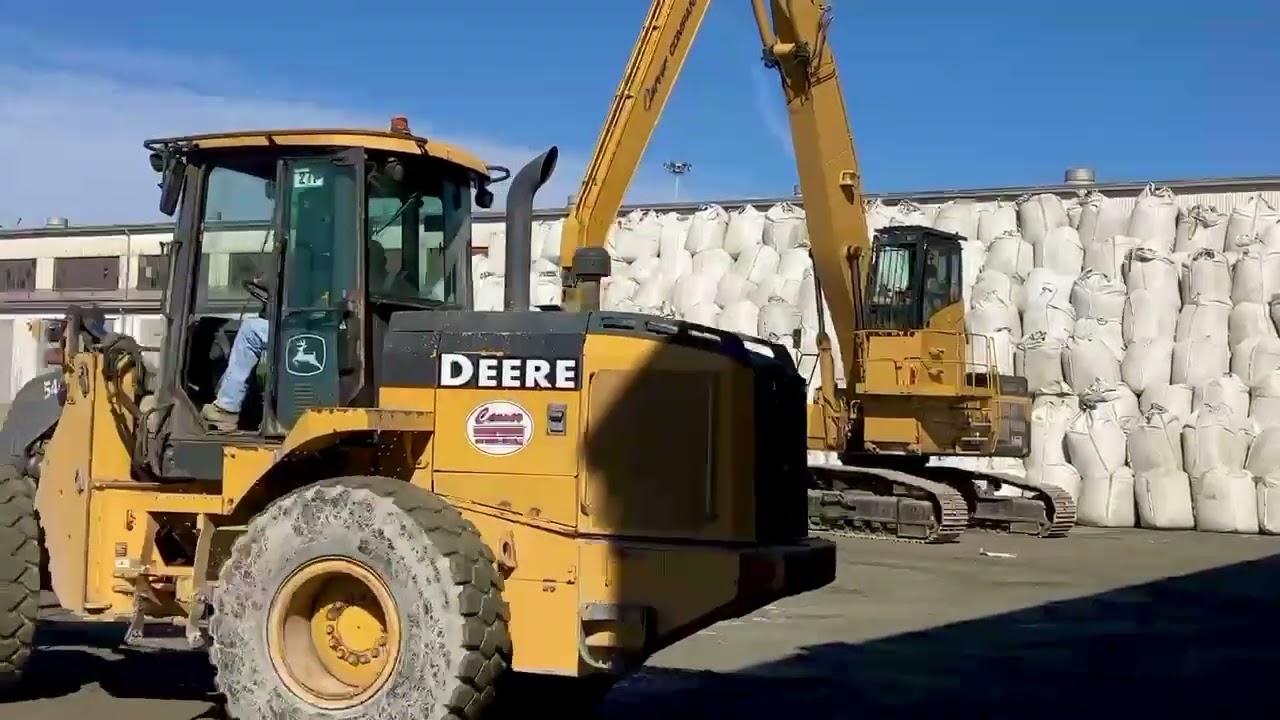 Unloading Cement Super Sacks with Loaders in Charleston SC
