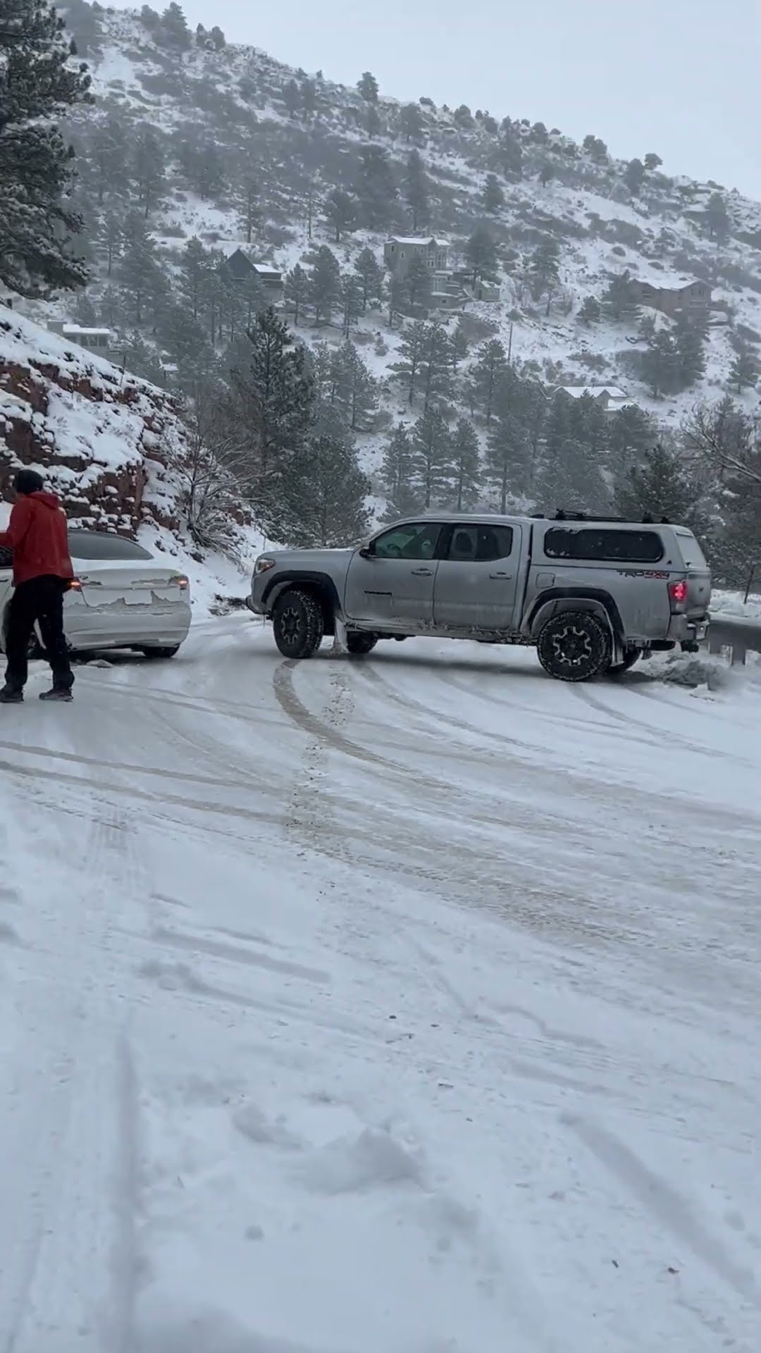 Icy Road Sends Cars Skidding on Windy Mountain Pass || ViralHog