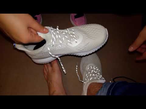 She is removing his Adidas Alpha Bounce