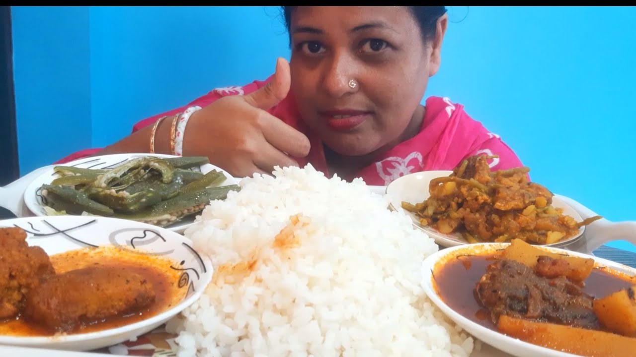 EATING RICE WITH BOILED BHINDI , FISH EGG CHOCHORI, FISH EGG CURRY AND