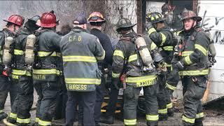 Abandoned house fire with injured firefighter.