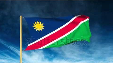 Namibia flag slider style. Waving in the wind with cloud background animation Stock video by