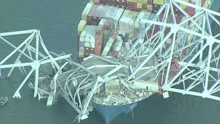Baltimore bridge collapses after ship rams into support column