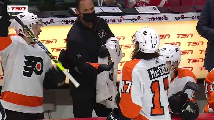 Zack MacEwen hands his teeth to equipment staff af...