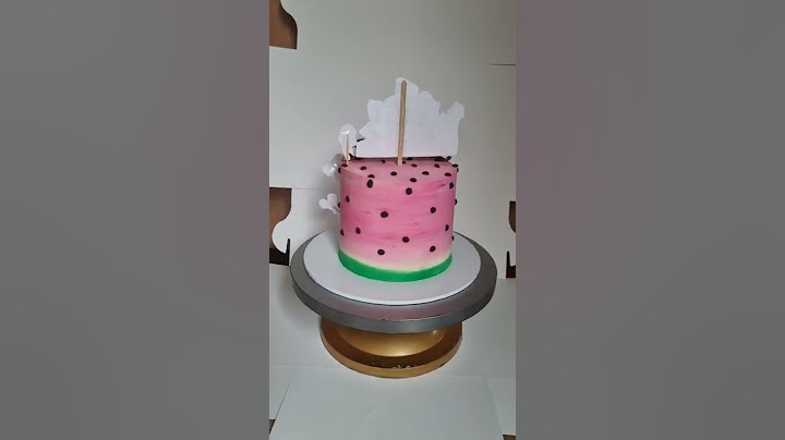 cocomelon theme 1st birthday cake in pink with whipped cream