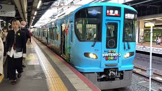 大阪環状線323系LS15編成ニンテンドーワールドマリオのラッピング車普通西九条・大阪方面行き発着シーン