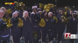 Lee County High School cheer team celebrates Sanford Christmas Parade