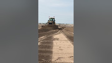 Amazing shantui bulldozers pushing on site construction.