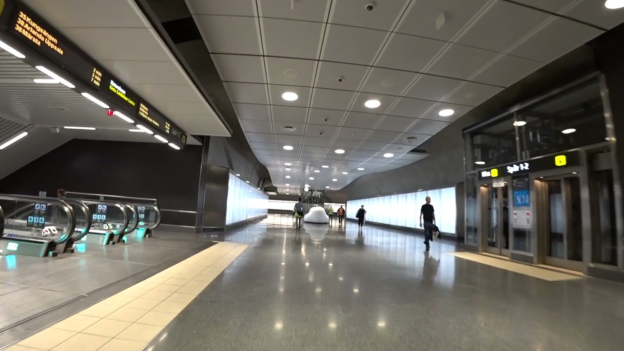 Sweden, Stockholm City train station, 3X elevator - going down to platform level