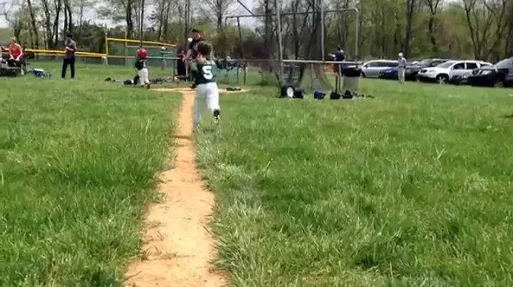 Ryan playing t-ball w/the Sand Gnats