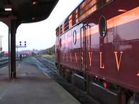 After a 4 year absence from Altoona Railfest, Juniata Terminal's beautifully restored Pennsylvania Railroad EMD E8 locomotives have returned to the high iron! As part of Railfest, the Es pulled the "Gateway Tripper", a round trip excursion from Altoona to Pittsburgh and back. This clip features the train arriving and being parked in Penn Station in downtown Pittsburgh. Also included is a NS RoadRailer train, powered by two GE C40-9Ws. Video shot on July 7, 2007.