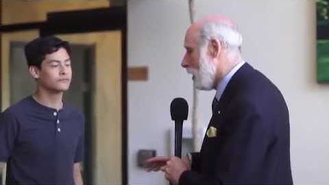 Vint Cerf gives a family a tour of room TCP/IP conceived in