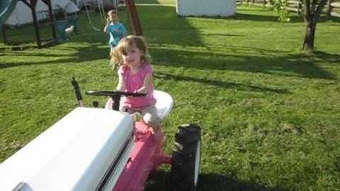 Kaitlyn driving her pink cub cadet 72 for the first time
