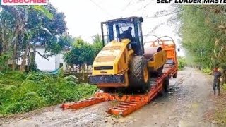 The process of loading and unloading a compactor or vibro (vibratory roller) onto a self-loader